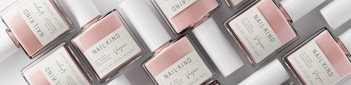 Nailkind nail polish bottles in soft pink